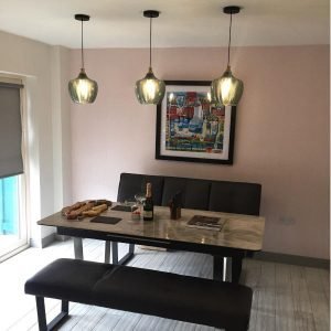 teal pendants above dining table