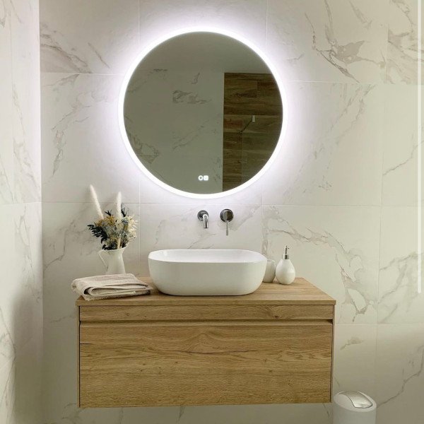 600mm round bluetooth bathroom mirror above sink in bathroom area