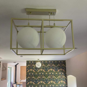double white glass dome lights in a gold frame semi-flush to ceiling