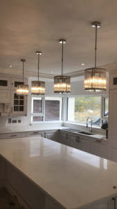 clear glass pendant lights above kitchen island