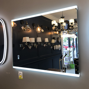 800x600mm sidelit led bluetooth mirror with colour changing capability on display in a showroom