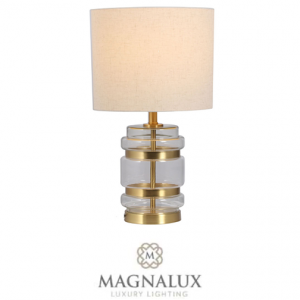 satin brass table lamp with crystal decorative features and a round fabric shade