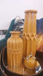 modern orange decor including vases and flower pots
