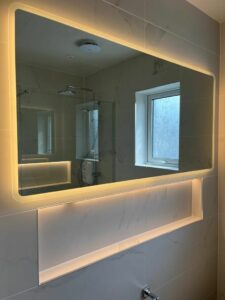 large landscape bluetooth led bathroom mirror with a warm white glow