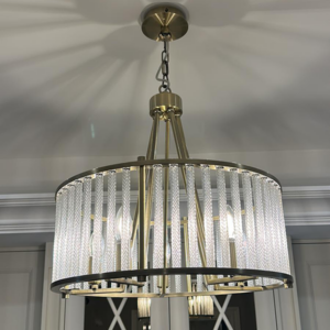 5 light chandelier finished in antique brass gold with crystal bars